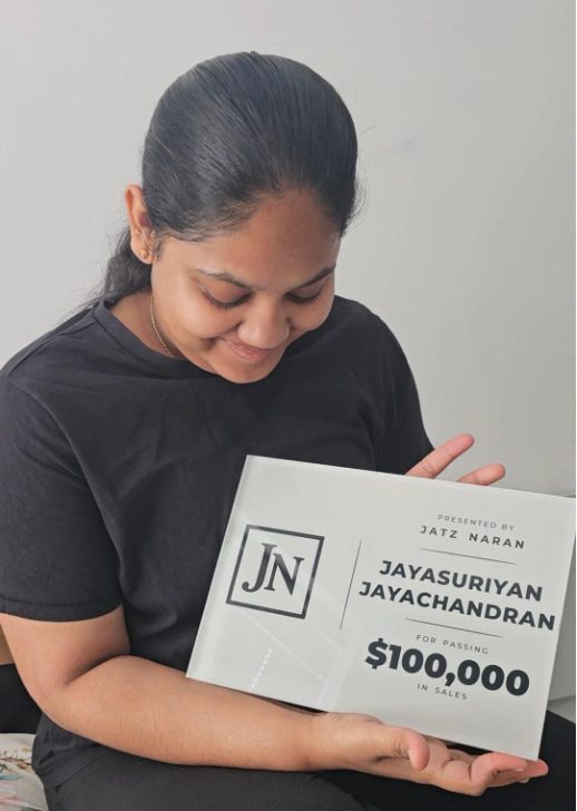 Jayasuriyan Jayachandran with her $100,000 sales award