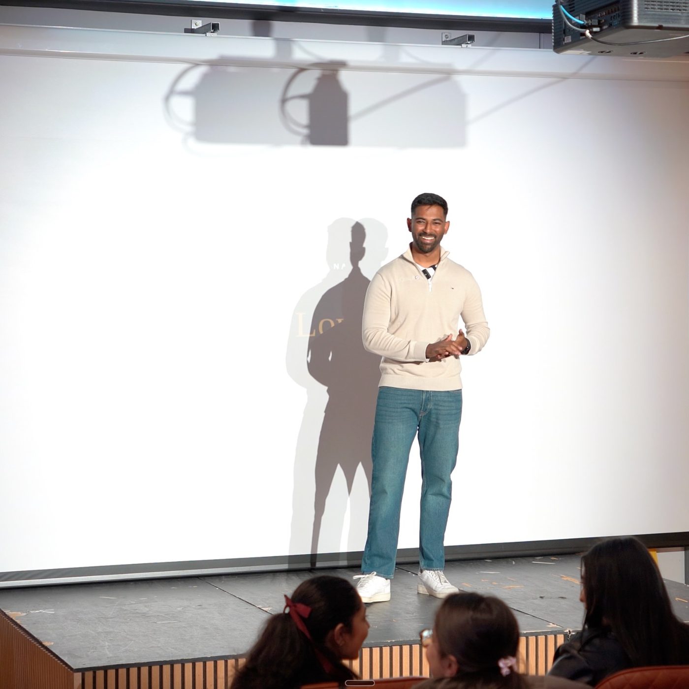 Jatz on stage at a meetup