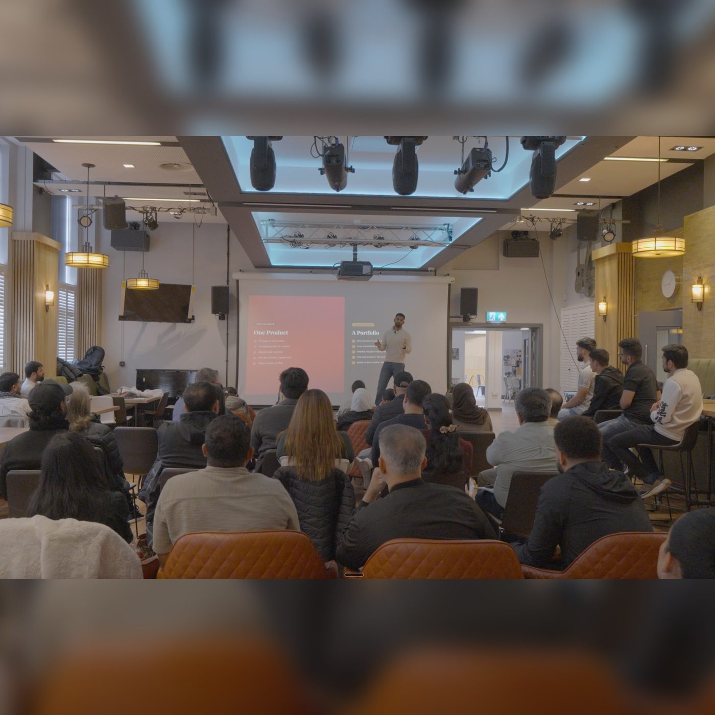 Jatz presenting to a full room
